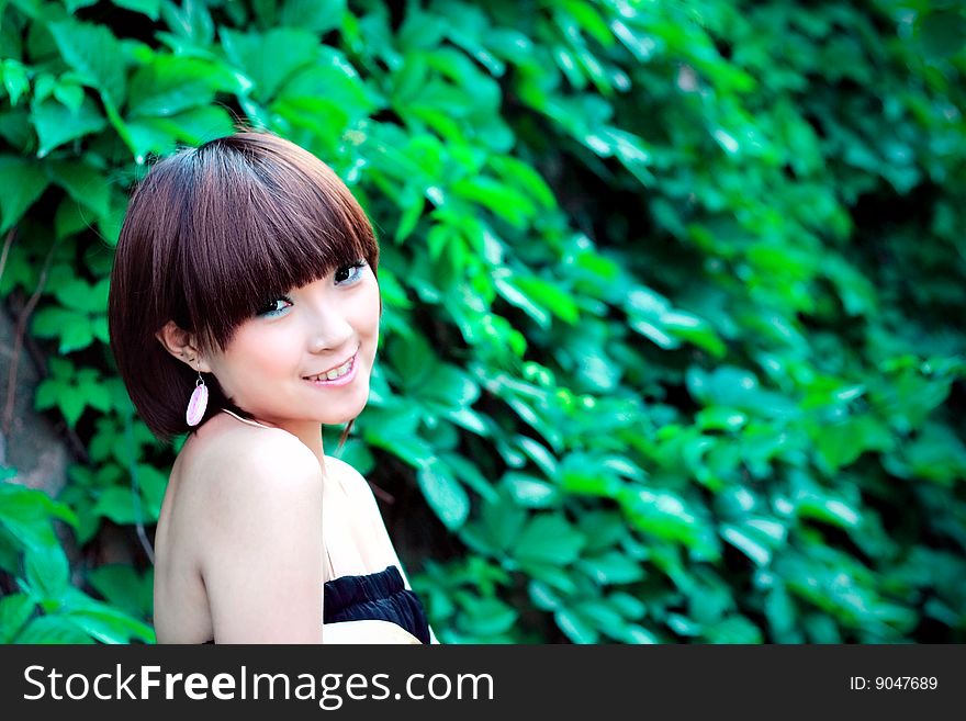 Chinese pretty girl in a park