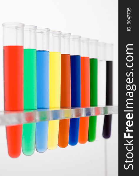 Test tube with colored water on white background. Test tube with colored water on white background