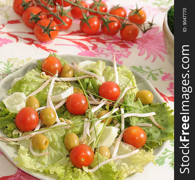 Salad of tomatoes, soia, olives and cucumbers. Salad of tomatoes, soia, olives and cucumbers