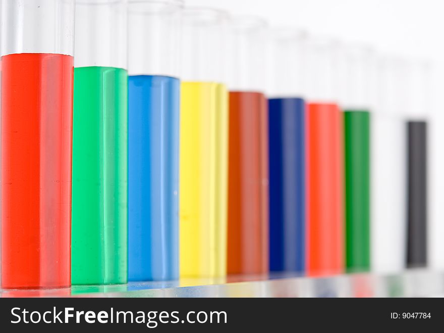 Test tube with colored water on white background. Test tube with colored water on white background