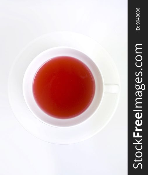 Red tea in white cup and saucer. Red tea in white cup and saucer