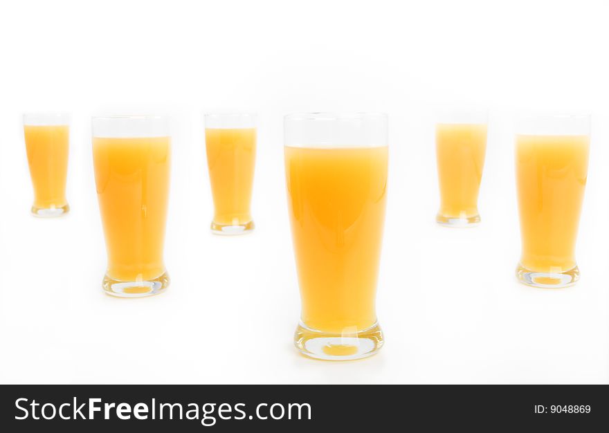 Glasses with orange juice on a white background