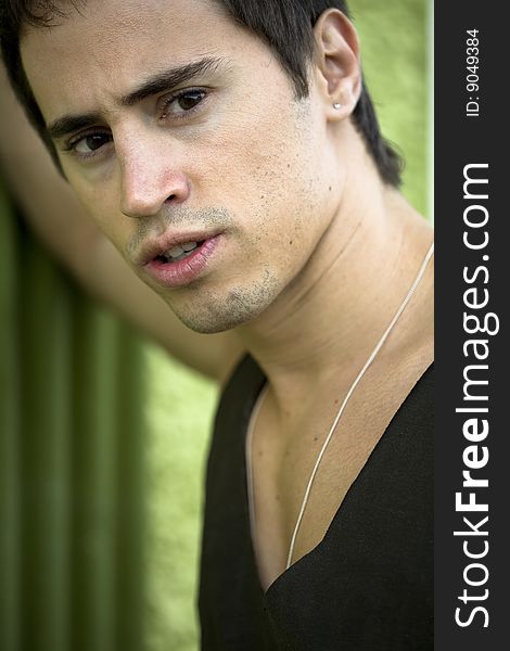 A young male model from Brazil in outdoors photograph. A young male model from Brazil in outdoors photograph.