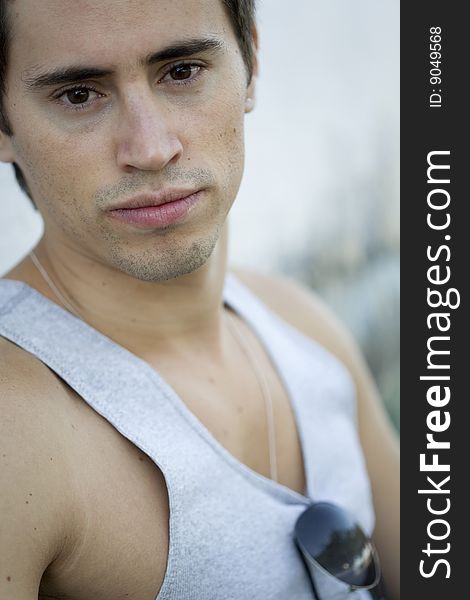 A young male model from Brazil in outdoors photograph. A young male model from Brazil in outdoors photograph.