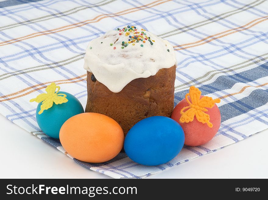 Easter cake and Easter eggs on background. Tradition decorative bread. Selective focus