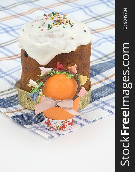 Easter cake and Easter egg on background. Tradition decorative bread. Selective focus