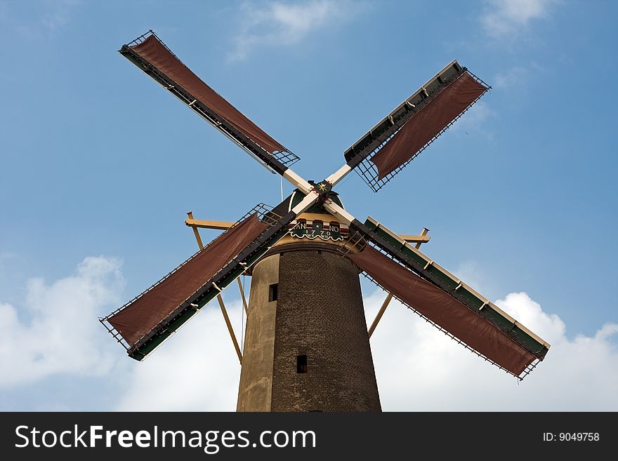 Dutch windmill in Schiedam, The Netherlands. Blue sky background.