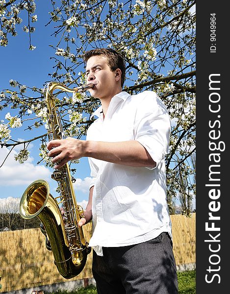 Saxy men player on saxophone. Saxy men player on saxophone