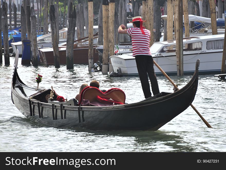 The water streets of Venice are canals which are navigated by gondolas and other small boats. During daylight hours the canals, bridges, and streets of Venice are full of tourists eager to experience the romance of this great travel destination. As night engulfs the town, tourists enjoy some fine dining at one of the many restaurants, leaving the waterways and streets quiet. The gondola is a traditional, flat-bottomed Venetian rowing boat, well suited to the conditions of the Venetian Lagoon. For centuries gondolas were once the chief means of transportation and most common watercraft within Venice. In modern times the iconic boats still have a role in public transport in the city, serving as ferries over the Grand Canal. They are also used in special regattas &#x28;rowing races&#x29; held amongst gondoliers. Their main role, however, is to carry tourists on rides throughout the canals. Gondolas are hand made using 8 different types of wood &#x28;fir, oak, cherry, walnut, elm, mahogany, larch and lime&#x29; and are composed of 280 pieces. The oars are made of beech wood. The left side of the gondola is longer than the right side. This asymmetry causes the gondola to resist the tendency to turn toward the left at the forward stroke. The water streets of Venice are canals which are navigated by gondolas and other small boats. During daylight hours the canals, bridges, and streets of Venice are full of tourists eager to experience the romance of this great travel destination. As night engulfs the town, tourists enjoy some fine dining at one of the many restaurants, leaving the waterways and streets quiet. The gondola is a traditional, flat-bottomed Venetian rowing boat, well suited to the conditions of the Venetian Lagoon. For centuries gondolas were once the chief means of transportation and most common watercraft within Venice. In modern times the iconic boats still have a role in public transport in the city, serving as ferries over the Grand Canal. They are also used in special regattas &#x28;rowing races&#x29; held amongst gondoliers. Their main role, however, is to carry tourists on rides throughout the canals. Gondolas are hand made using 8 different types of wood &#x28;fir, oak, cherry, walnut, elm, mahogany, larch and lime&#x29; and are composed of 280 pieces. The oars are made of beech wood. The left side of the gondola is longer than the right side. This asymmetry causes the gondola to resist the tendency to turn toward the left at the forward stroke.