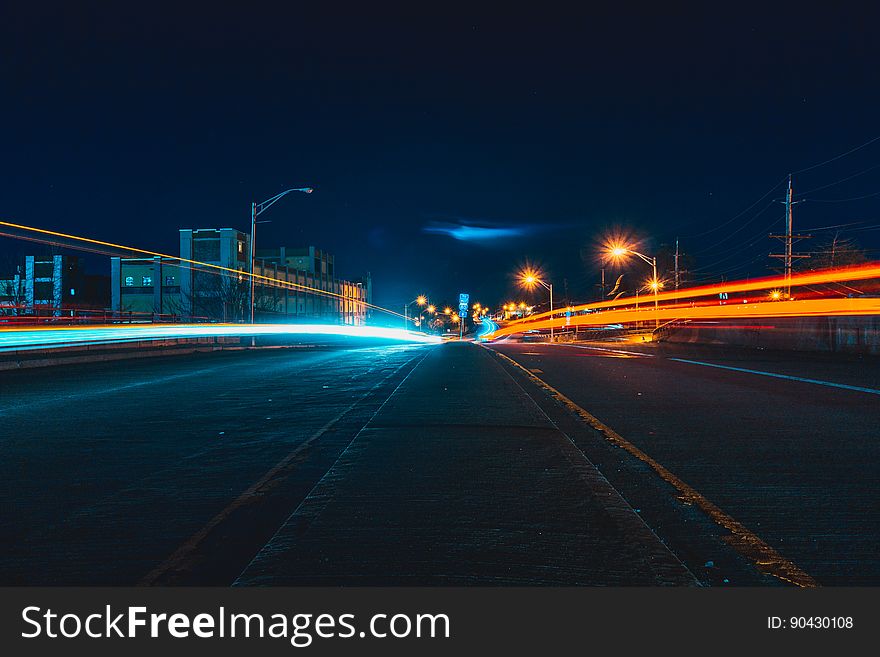 Light trails left by traffic with long exposure on a highway at night. Light trails left by traffic with long exposure on a highway at night.