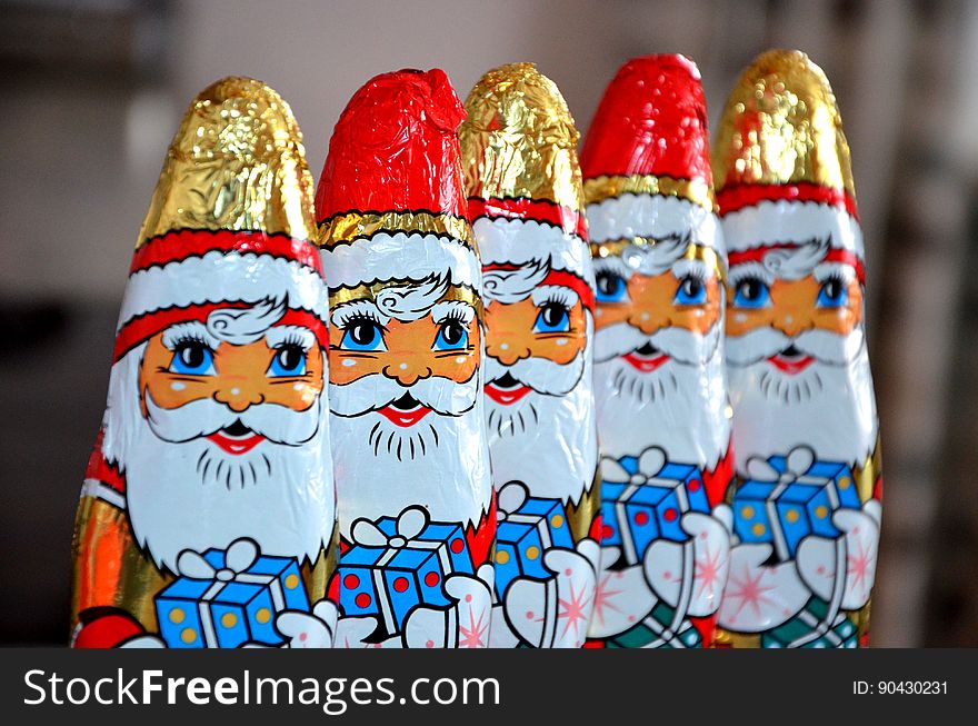 Red White Gold and Blue Santa Claus Carrying Gift Sweets Line