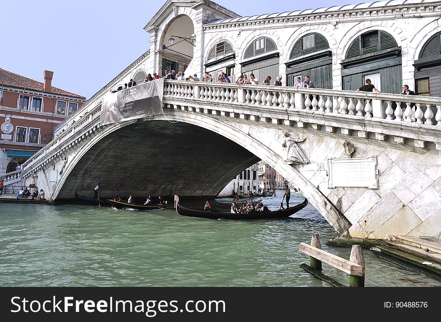 The water streets of Venice are canals which are navigated by gondolas and other small boats. During daylight hours the canals, bridges, and streets of Venice are full of tourists eager to experience the romance of this great travel destination. As night engulfs the town, tourists enjoy some fine dining at one of the many restaurants, leaving the waterways and streets quiet. The gondola is a traditional, flat-bottomed Venetian rowing boat, well suited to the conditions of the Venetian Lagoon. For centuries gondolas were once the chief means of transportation and most common watercraft within Venice. In modern times the iconic boats still have a role in public transport in the city, serving as ferries over the Grand Canal. They are also used in special regattas &#x28;rowing races&#x29; held amongst gondoliers. Their main role, however, is to carry tourists on rides throughout the canals. Gondolas are hand made using 8 different types of wood &#x28;fir, oak, cherry, walnut, elm, mahogany, larch and lime&#x29; and are composed of 280 pieces. The oars are made of beech wood. The left side of the gondola is longer than the right side. This asymmetry causes the gondola to resist the tendency to turn toward the left at the forward stroke. The water streets of Venice are canals which are navigated by gondolas and other small boats. During daylight hours the canals, bridges, and streets of Venice are full of tourists eager to experience the romance of this great travel destination. As night engulfs the town, tourists enjoy some fine dining at one of the many restaurants, leaving the waterways and streets quiet. The gondola is a traditional, flat-bottomed Venetian rowing boat, well suited to the conditions of the Venetian Lagoon. For centuries gondolas were once the chief means of transportation and most common watercraft within Venice. In modern times the iconic boats still have a role in public transport in the city, serving as ferries over the Grand Canal. They are also used in special regattas &#x28;rowing races&#x29; held amongst gondoliers. Their main role, however, is to carry tourists on rides throughout the canals. Gondolas are hand made using 8 different types of wood &#x28;fir, oak, cherry, walnut, elm, mahogany, larch and lime&#x29; and are composed of 280 pieces. The oars are made of beech wood. The left side of the gondola is longer than the right side. This asymmetry causes the gondola to resist the tendency to turn toward the left at the forward stroke.