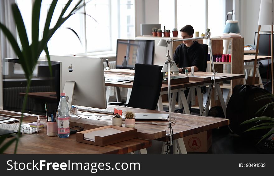 Retro office with tables and a plant