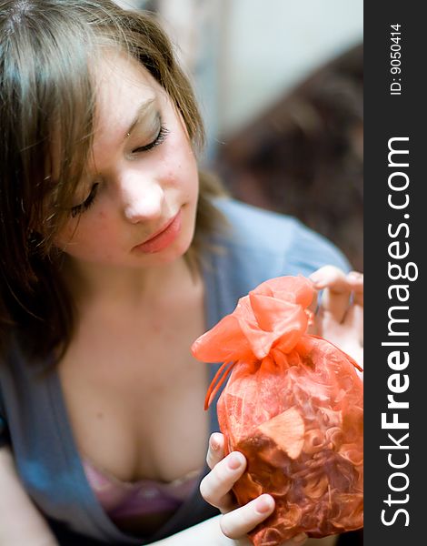 Portrait of a beautiful girl with a present. Portrait of a beautiful girl with a present