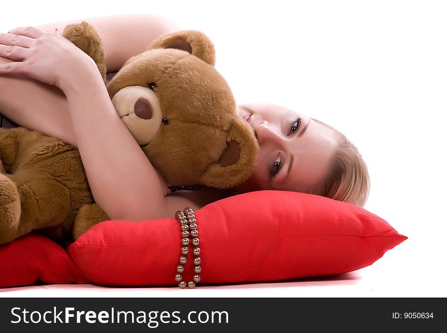 Woman with a toy bear on a white background. Woman with a toy bear on a white background
