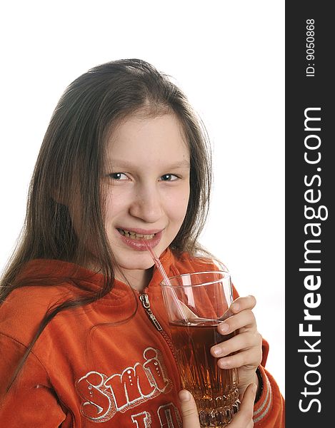 Young girl reading a book and drinking a fresh juice. Young girl reading a book and drinking a fresh juice