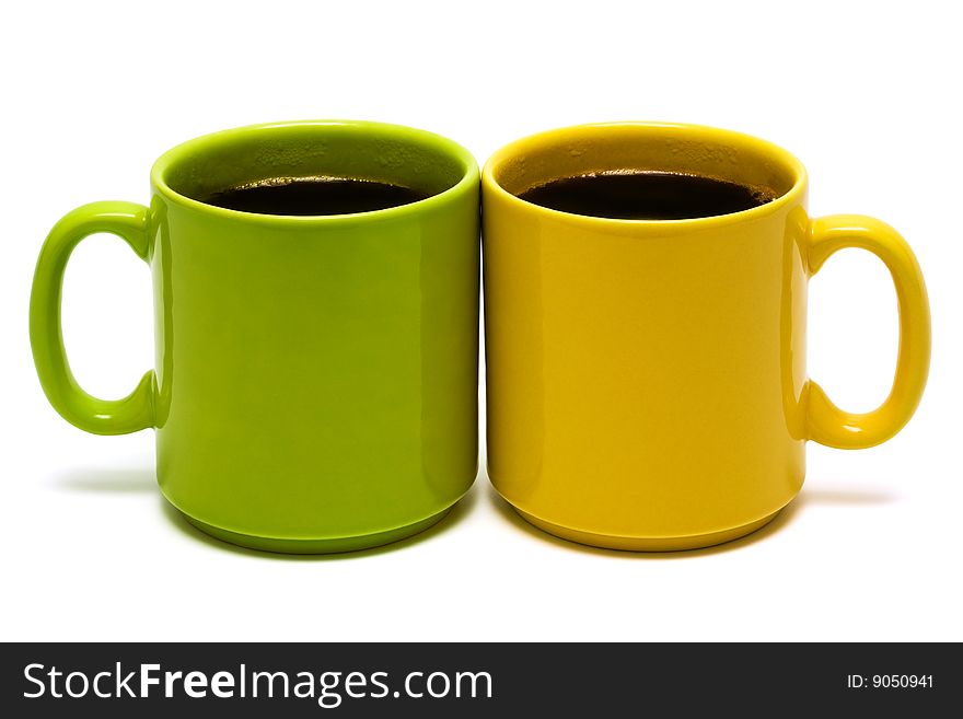 Yellow and green mug on a white background