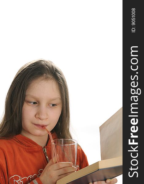 Reading girl with glass of juice