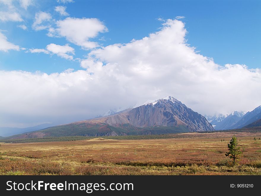 Mountain Range With Yellow Grass Valley