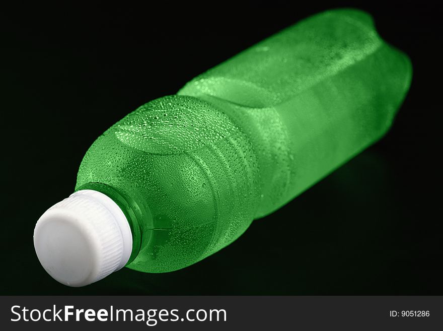 A image of a isolated green bottle of water.