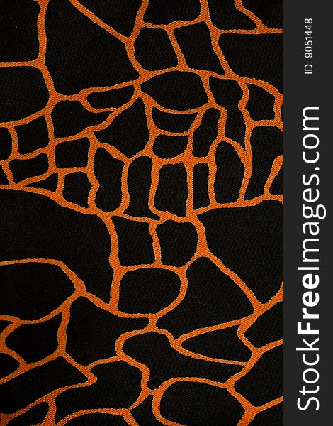 Close-up black fabric cloth with orange pattern