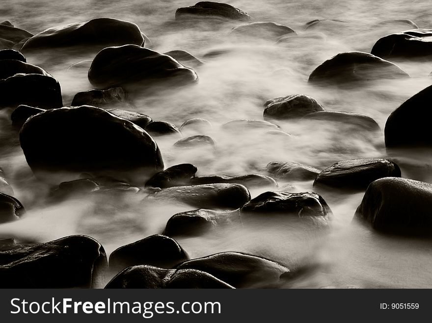 The capture of water rushing through rocks. The capture of water rushing through rocks.