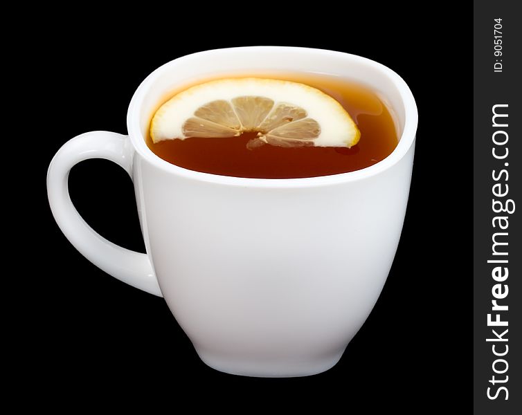 Cup of tea with lemon on black