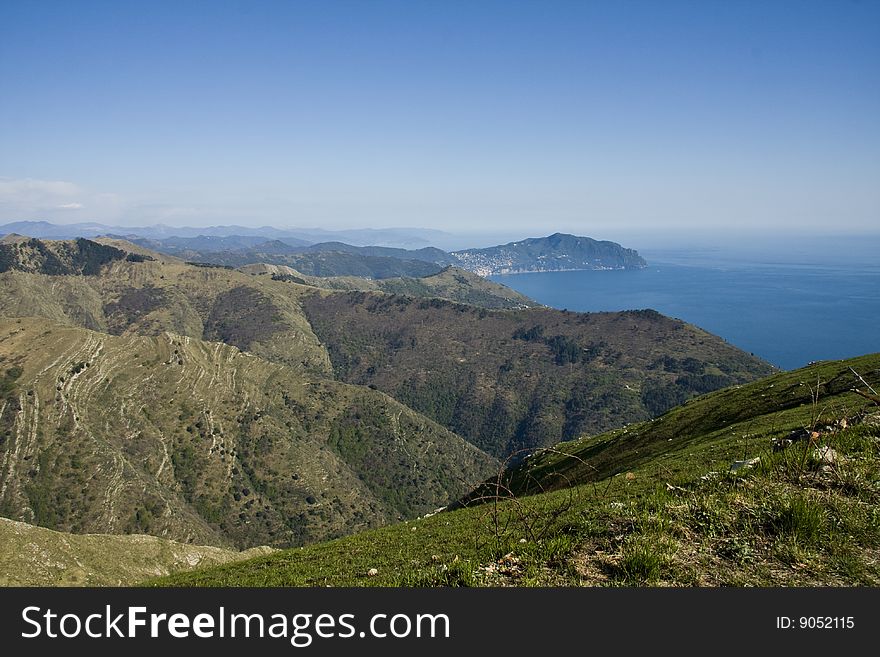 Beautiful view from the hills around Genoa. On the background the famous mounth of Portofino Italy. Beautiful view from the hills around Genoa. On the background the famous mounth of Portofino Italy