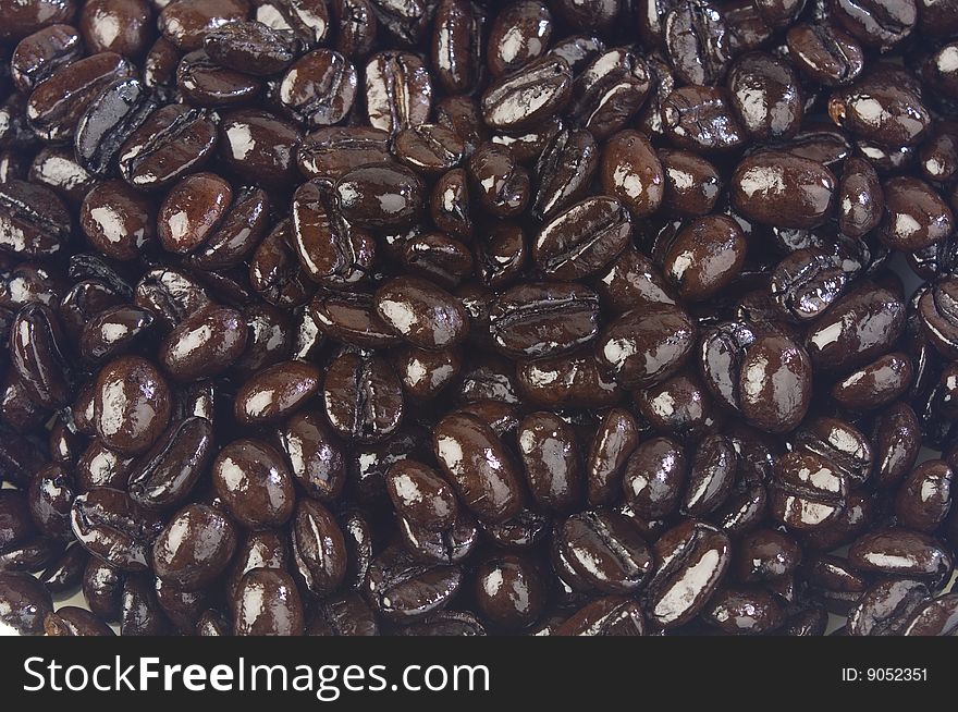 Close up of fresh dark roasted coffee beans