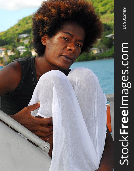 Face of black woman with natural afro hair style on yacht. Face of black woman with natural afro hair style on yacht.
