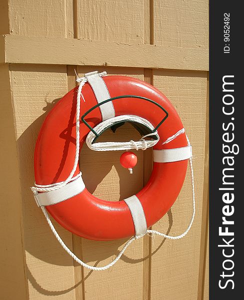 Pool life preserver hanging on wall