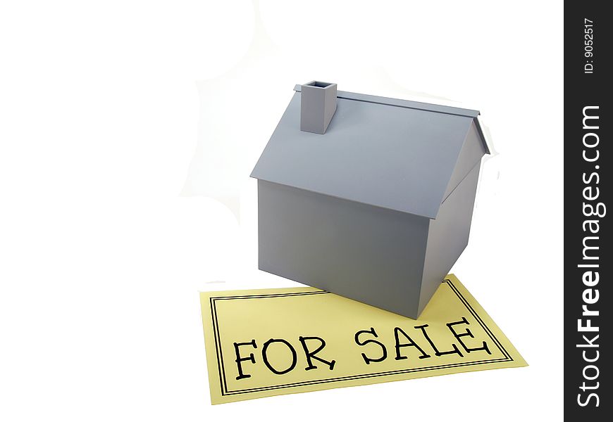 Scale model house with for sale sign. Scale model house with for sale sign.