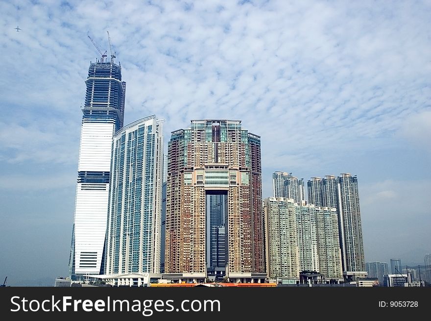 Hongkong, Kowloon, modern buildings, residential area at the harbour, near sea-side. Hongkong, Kowloon, modern buildings, residential area at the harbour, near sea-side.