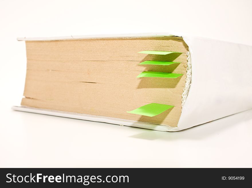 Book with green bookmarks white