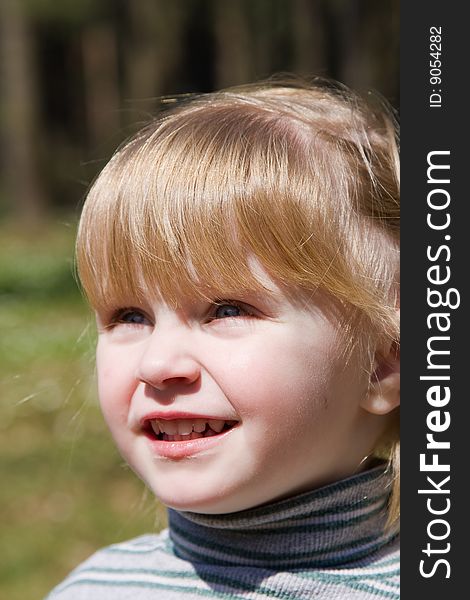 Beautiful smiling baby on the nature