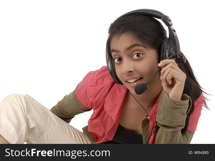 Young beautiful girl listening music in headphone over white background. Young beautiful girl listening music in headphone over white background