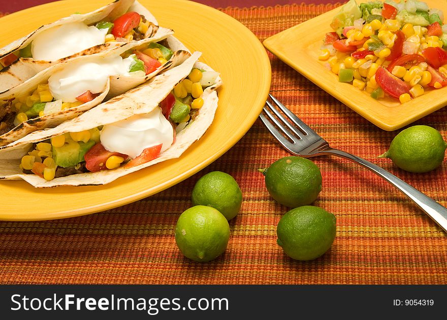 Beef Folded Tortilla Tacos with corn, tomato, avacado,onion, and pepper salsa