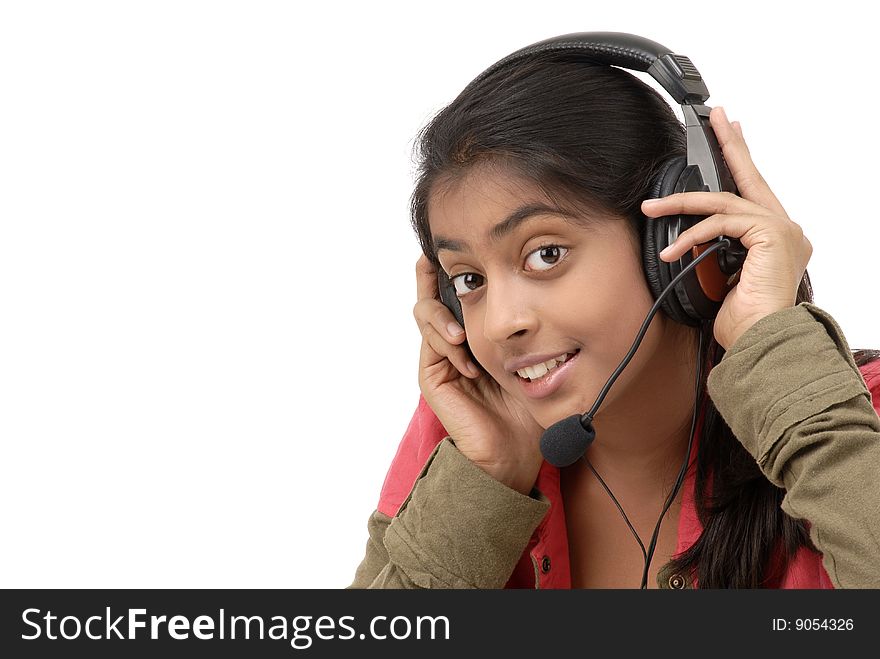 Young beautiful girl listening music in headphone over white background. Young beautiful girl listening music in headphone over white background