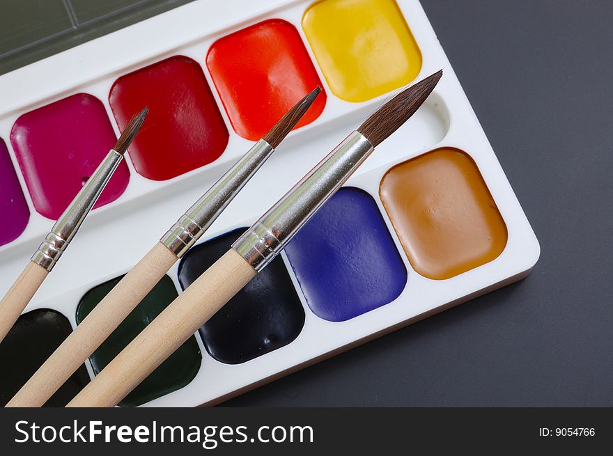 Collection of brushes and palette. Set the artist.