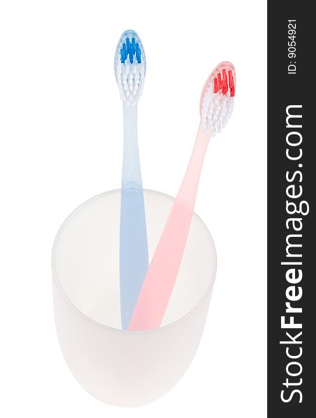 Colored toothbrush in glass. With clipping path.