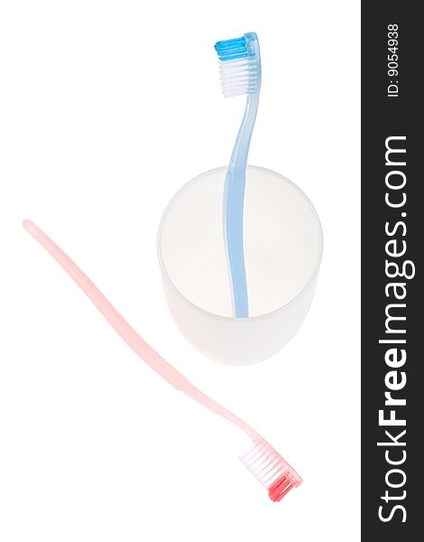 Colored toothbrush in glass. With clipping path.