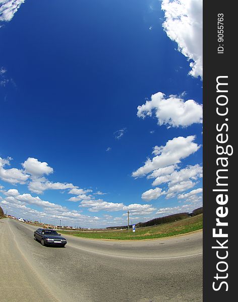 Field on a background of the blue sky. Field on a background of the blue sky