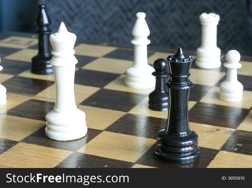 Chess under the white background. Focus is under the front chessman