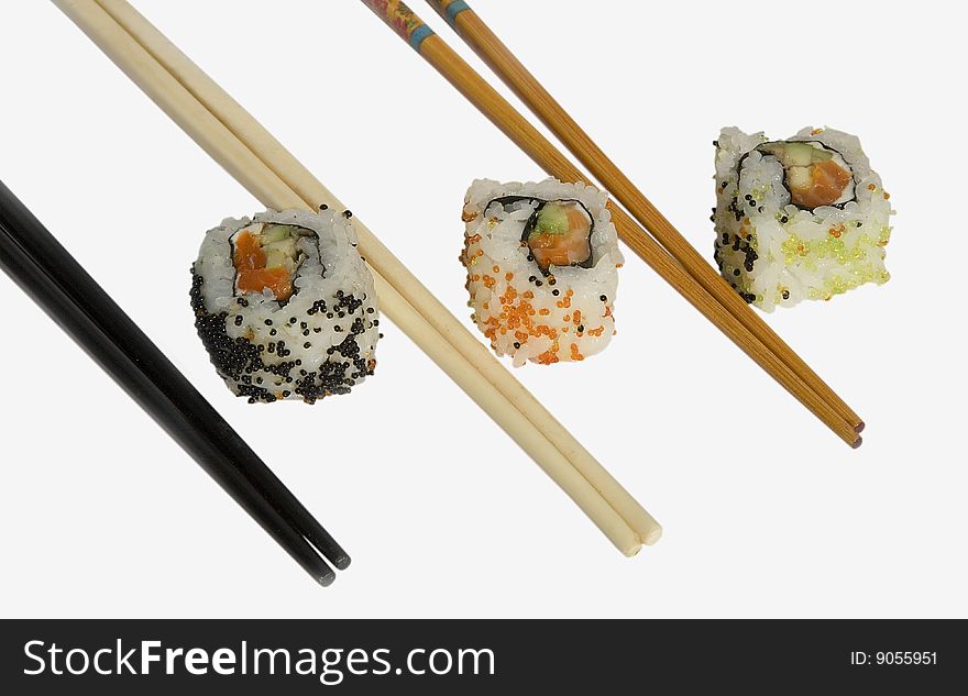 Sushi with chopsticks shot on white background