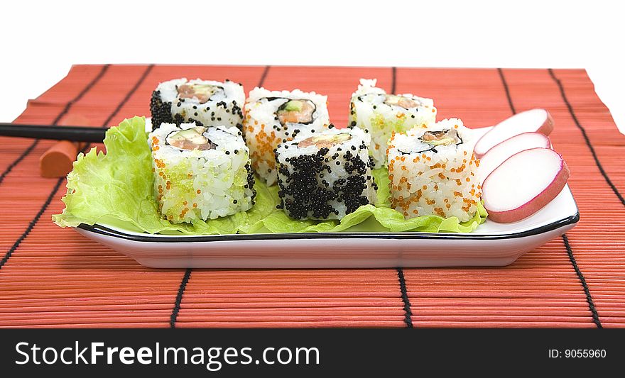 Tasty different sushi on a saucer in the Japanese restaurant