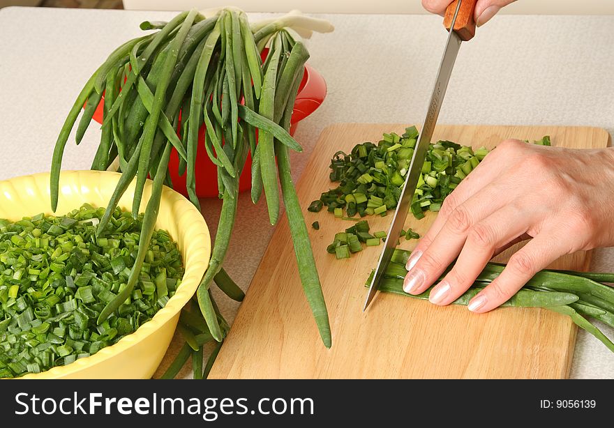 Cutting of a green onions, process of preparation. Cutting of a green onions, process of preparation