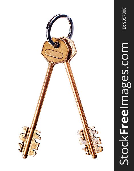 Brass keys with ring on white background with clipping path