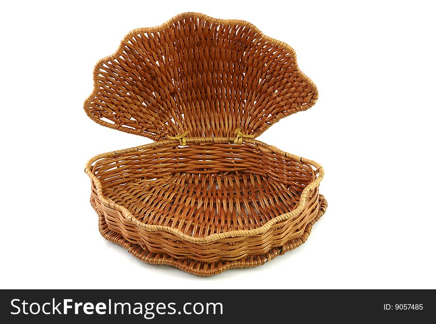 Open and empty woven basket isolated on white background