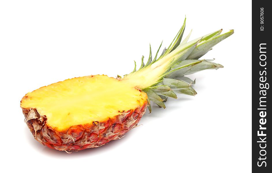 Ripe sweet section pineapple isolated on white background