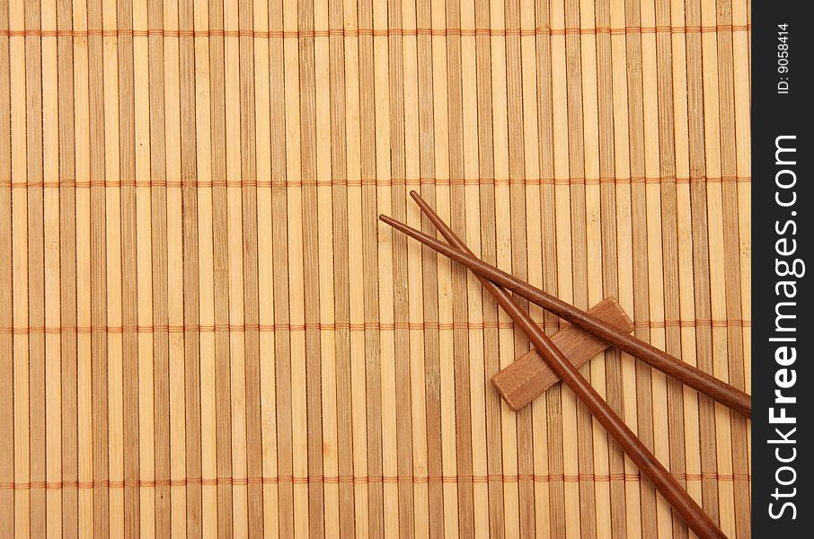 Wooden mat and eating sticks